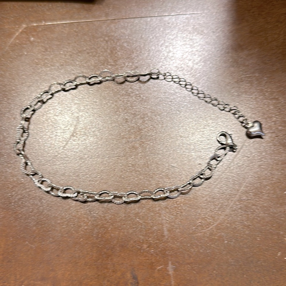 Heart shaped metal bracelet. No markings